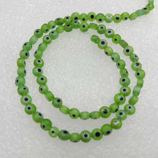 Light green Evil eye flat shape beads 4mm 1 string