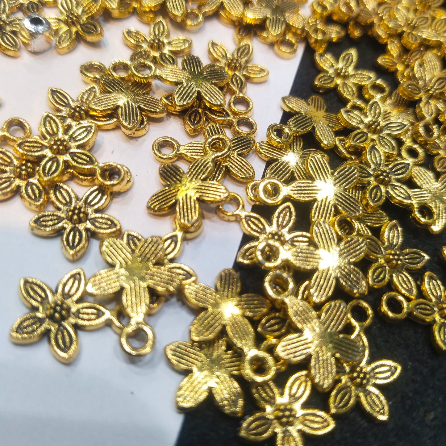 Gold-toned oxidized floral metal spacers charms 12mm 1 pkt 100 pcs.