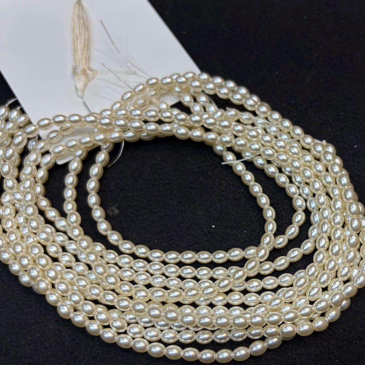 Metallic cream colour high quality oval shape pearl beads 1 string.