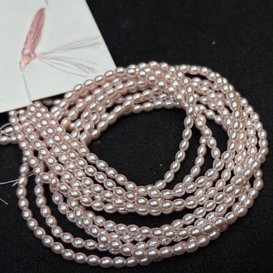 Metallic Pink colour high quality oval shape pearl beads 1 string.