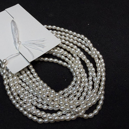 Metallic off white colour high quality oval shape pearl beads 1 string.