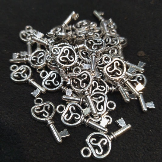 Triskelion key silver oxidized metals 16mm 1 pkt 60 pcs.