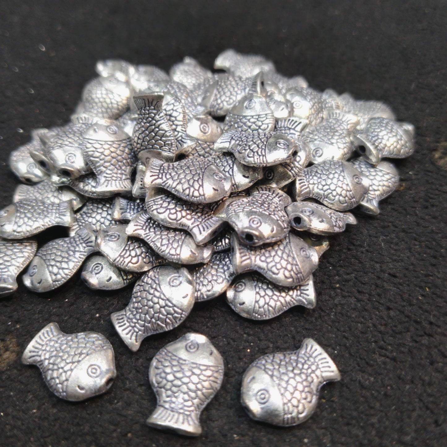 Silver oxidized plump doubled sided fish metal 12mm 1 pkt 60 pcs.