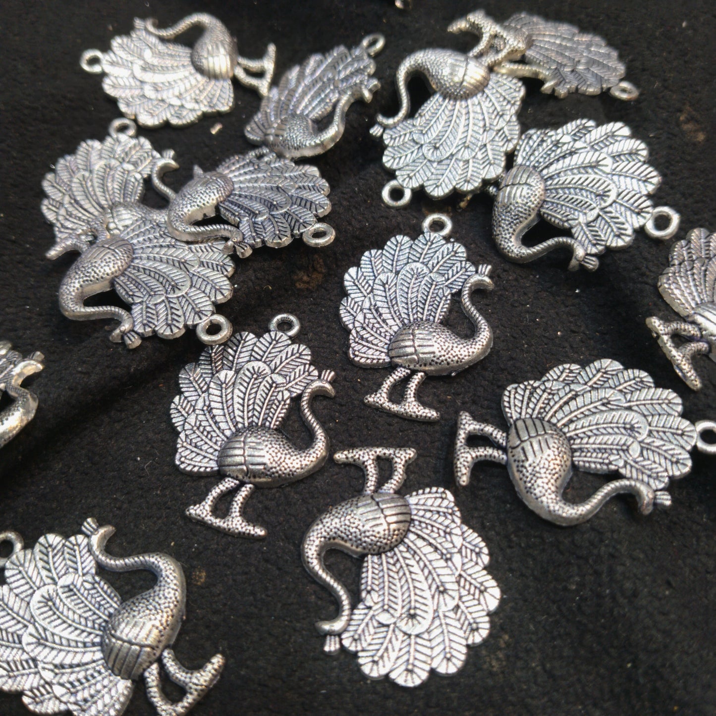 Silver oxidized metal peacock 25mm 1 pkt 50 pcs.
