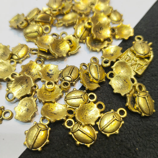 Antique gold-finish pill shaped studs 10mm 100 pcs.