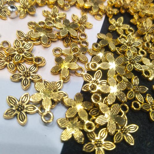Gold-toned oxidized floral metal spacers charms 12mm 1 pkt 100 pcs.